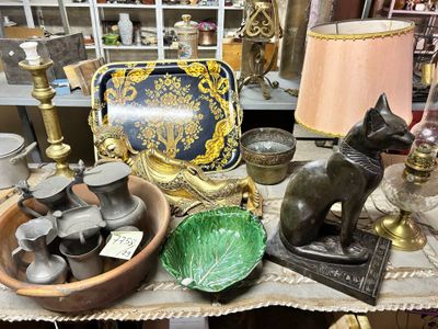 a table with a lot of antiques on it