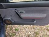 the door panel of a car with a speaker in it