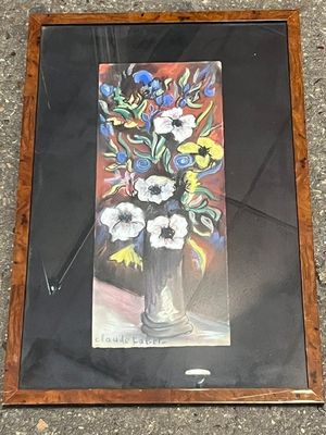 une photo d'un tableau représentant des fleurs dans un vase posé par terre