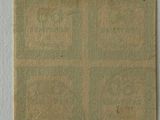 a close up of a piece of paper on a white surface
