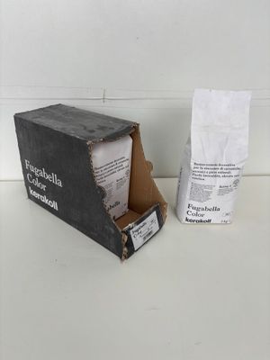 a box of coffee sitting on a table next to a bag of coffee