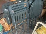 a lot of chairs that are sitting in the garage
