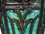 a close up of a vase with a planter on it