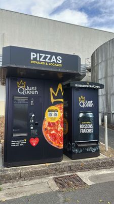 two vending machines that are on the side of the road