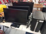 a lot of computer equipment on the table