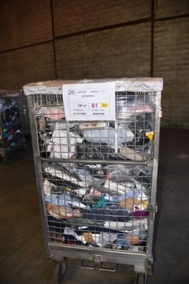a metal cart with many items in it in a warehouse