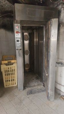a metal door that is open in a room
