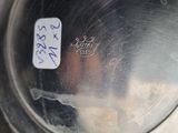 a close up of a metal container with a sticker on it