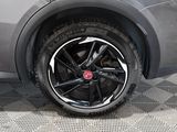 a close up of a car tire on a checkered floor