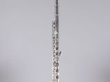 a flute that is sitting on top of a stand
