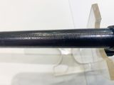 a close up of a gun on display in a glass case