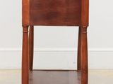 an image of a small wooden table with a drawer underneath it