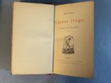 an open book with a picture of a man and a dog on it