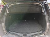 a trunk of a car with the back door open