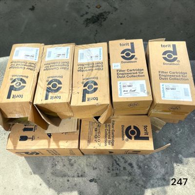 several boxes are stacked on top of each other on a sidewalk