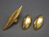 a pair of gold plated cufflinks and a pair of gold plated cufflinks