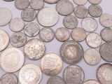 a lot of coins that are on the table
