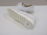 they are white shoes on a white surface with a white sole