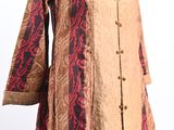 a woman ' s dress with a red and brown pattern on it