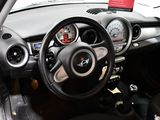 a car dashboard with a steering wheel and dashboard gauges