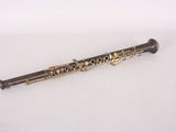 a close up of a flute on a white surface with a white background