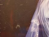 a picture of a woman with a veil on her head