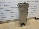 an image of a stainless steel water dispenser in front of a wall