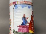 a white mug with a picture of a man and a woman on it