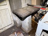 a concrete sink sitting in the corner of a room