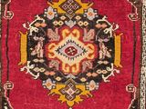 an oriental rug with a medallion design on a red ground