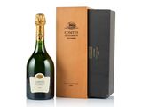 the bottle of champagne is next to a cardboard box