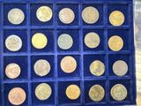 a box with a lot of gold coins in it