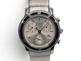 an image of a close up of a wrist watch on a white surface