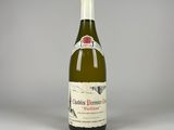 une photo d'une bouteille de vin blanc posée sur une table
