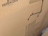 cardboard box on the floor of a home with a computer on it