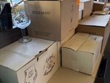 many boxes of wine sitting on a table