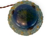 an image of a blue and green object on a string