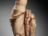 a statue of a woman holding a vase in her hands