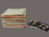 a lot of books stacked on top of each other