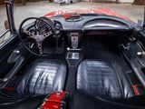 a black and red car inside of a garage