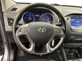 the interior of a car with a steering wheel and dashboard controls
