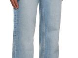 the woman is wearing a white shirt and blue jeans