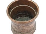 a brown vase with a pattern on it on a white background