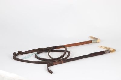 an image of a pair of swords and a sword on a white surface
