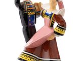a figurine of a man and a woman dancing