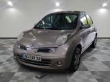 a picture of a small car parked in a garage