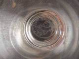 a close up view of a metal bowl with water in it