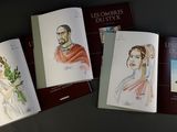 four books on a table with a drawing of a man and a woman