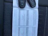 two car keys sitting on top of a piece of paper in the back seat of a car