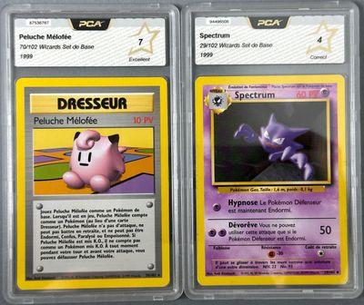 two pokemon trading cards are on display in a case
